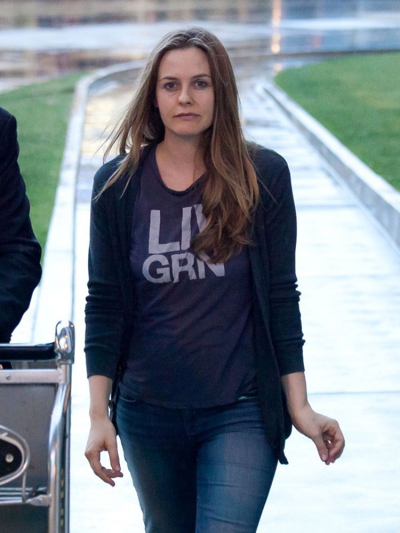 Alicia Silverstone in Jeans at LAX Airport - February 2014