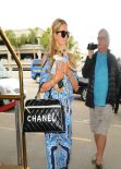 Paris Hilton in a Eye-Catching Outfit - At LAX airport in Los Angeles February 2014