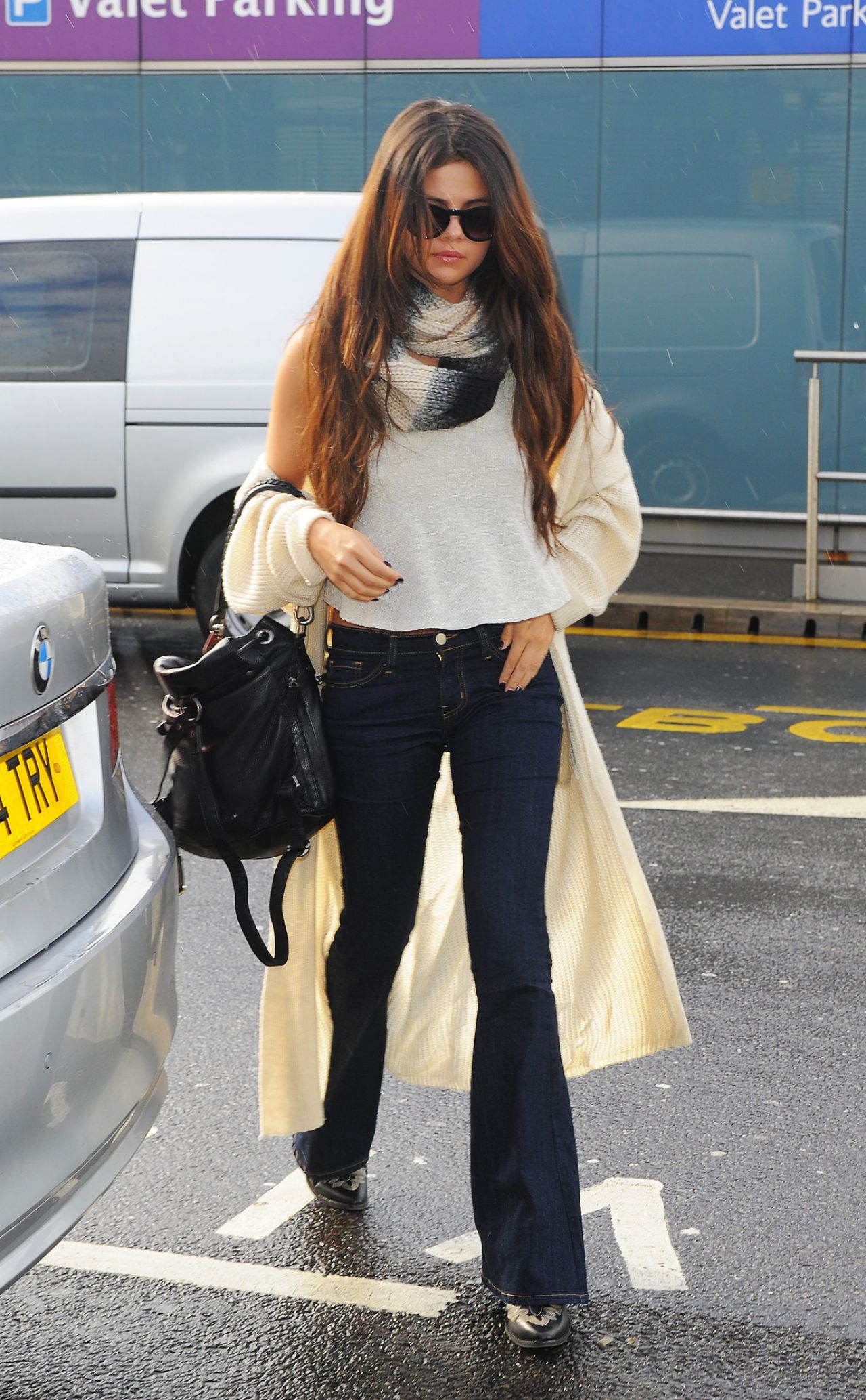Selena Gomez Street Style - At Heathrow Airport in London, February ...