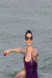 Anne Hathaway in a Swimsuit and Shorts at a Beach in Miami - March 2014