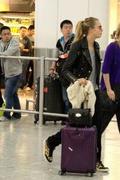 Cara Delevingne and Suki Waterhouse Arrive at Heathrow Airport in London - April 2014