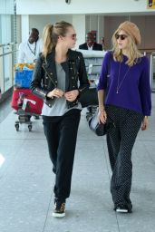 Cara Delevingne and Suki Waterhouse Arrive at Heathrow Airport in London - April 2014