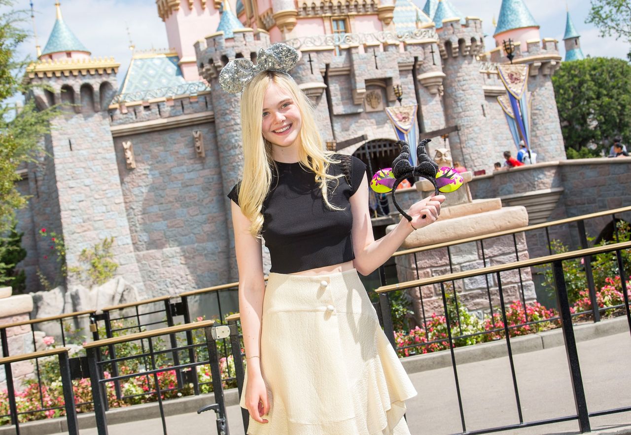 Elle Fanning Posing in a Black Top at Disneyland in Anaheim - April 2014