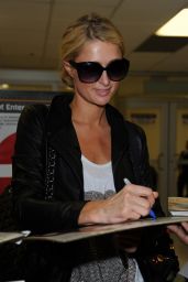  Paris Hilton in Tight Jeans at LAX Airport in Los Angeles - May 2014
