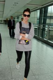 Barbara Palvin Looks Cheerful at Londons Heathrow Airport - June 2014
