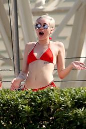 Miley Cyrus in Red Bikini at a hotel Pool in Barcelona - June 2014