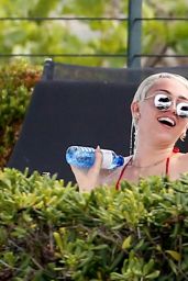 Miley Cyrus in Red Bikini at a hotel Pool in Barcelona - June 2014
