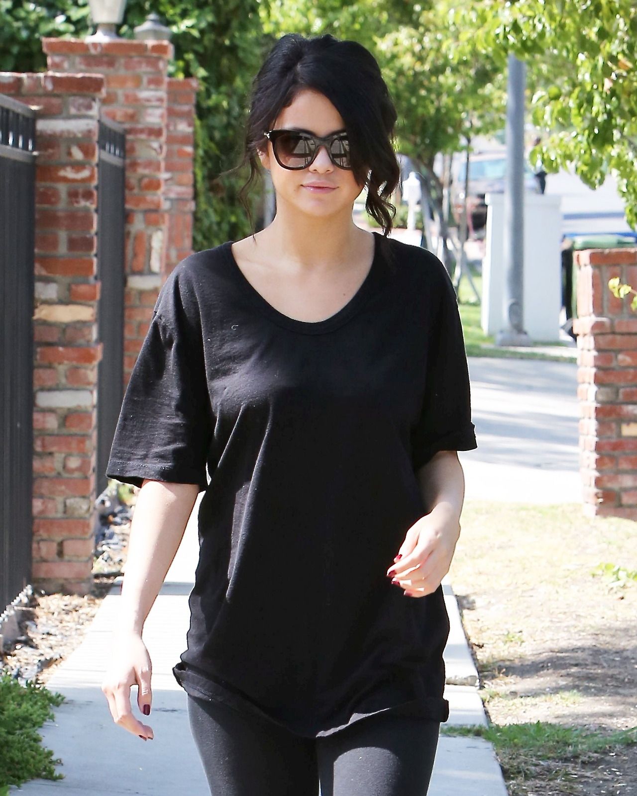 Selena Gomez Street Style Wearing Leggings And Boots Out In Los Angeles June 2014