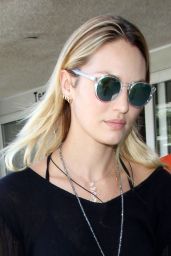 Candice Swanepoel in Ripped Jeans at LAX Airport - August 2014