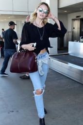 Candice Swanepoel in Ripped Jeans at LAX Airport - August 2014