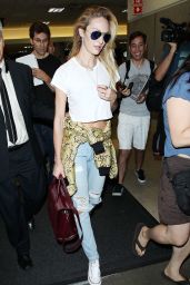 Candice Swanepoel in Ripped Jeans at LAX Airport - September 2014