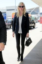 Kirsten Dunst Arriving at LAX Airport to Catch a Flight in Los Angeles - September 2014