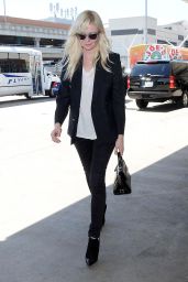 Kirsten Dunst Arriving at LAX Airport to Catch a Flight in Los Angeles - September 2014