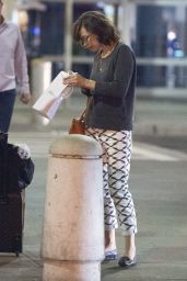 Milla Jovovich - Arrives at JFK Airport in New york City - September 2014