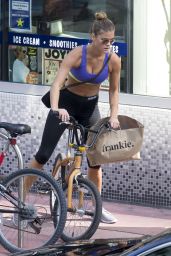 Nina Agdal in Leggings and Sports Bra - Riding a Bike in Miami - November 2014
