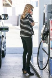 Emma Roberts Filling Up Her Car At A Local Gas Station  - Hollywood, December 2014