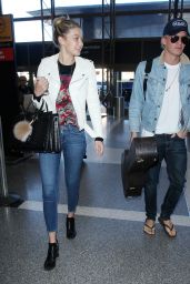 Gigi Hadid in Tight Jeans - at LAX Airport in Los Angeles, Dec. 2014