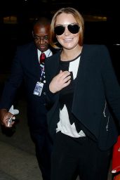 Lindsay Lohan Arriving on a flight at LAX Airport in Los Angeles - December 2014