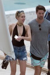 Miley Cyrus at a pool in Miami With Her Boyfriend - December 2014