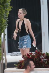Miley Cyrus at a pool in Miami With Her Boyfriend - December 2014