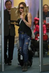 Katie Cassidy in Ripped Jeans at Vancouver International Airport, March 2015
