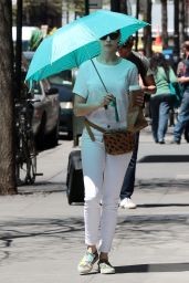 Anne Hathaway Spotted Using a Large Tturquoise Umbrella - New York City, April 2015