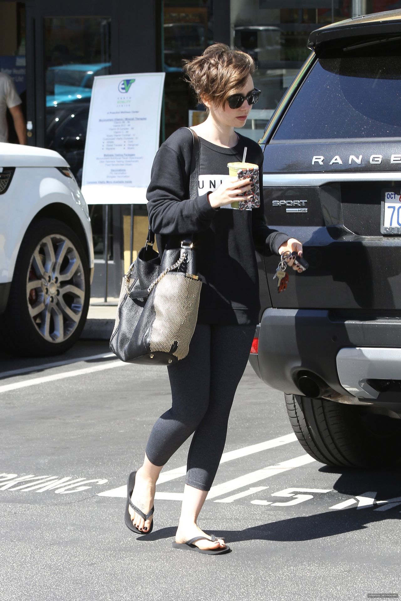 Lily Collins at a 'Car Wash of the Stars' in West Hollywood, April 2015 ...