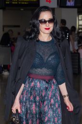 Dita Von Teese - Wearing Blue Top, Blue Skirt and a Large Black Coat ...