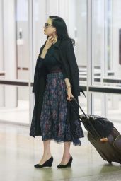 Dita Von Teese - Wearing Blue Top, Blue Skirt and a Large Black Coat - Melbourne Airport
