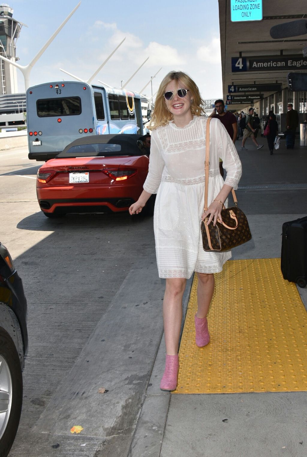 Elle Fanning at LAX Airport, September 2015 • CelebMafia