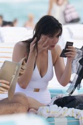 Daisy Lowe in aWhite Swimsuit on the Beach in Miami 12/30/2015 