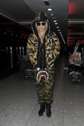 Rita Ora in Camouflage Tracksuit at Heathrow Airport in London 12/24/2015 