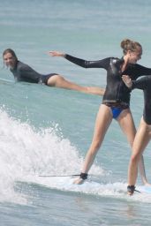 Cara Delevingne and Annie Clark Surf in Barbados 01/03/2016
