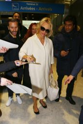 Pamela Anderson - Arriving at Roissy CDG Airport in Paris, January 2016