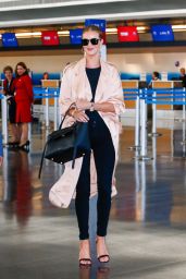 Rosie Huntington-Whiteley Glides Through JFK Airport in NYC 4/27/2016