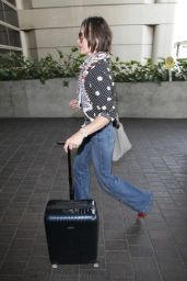 Milla Jovovich Travel Outfit - LAX Airport in Los Angeles 5/14/2016