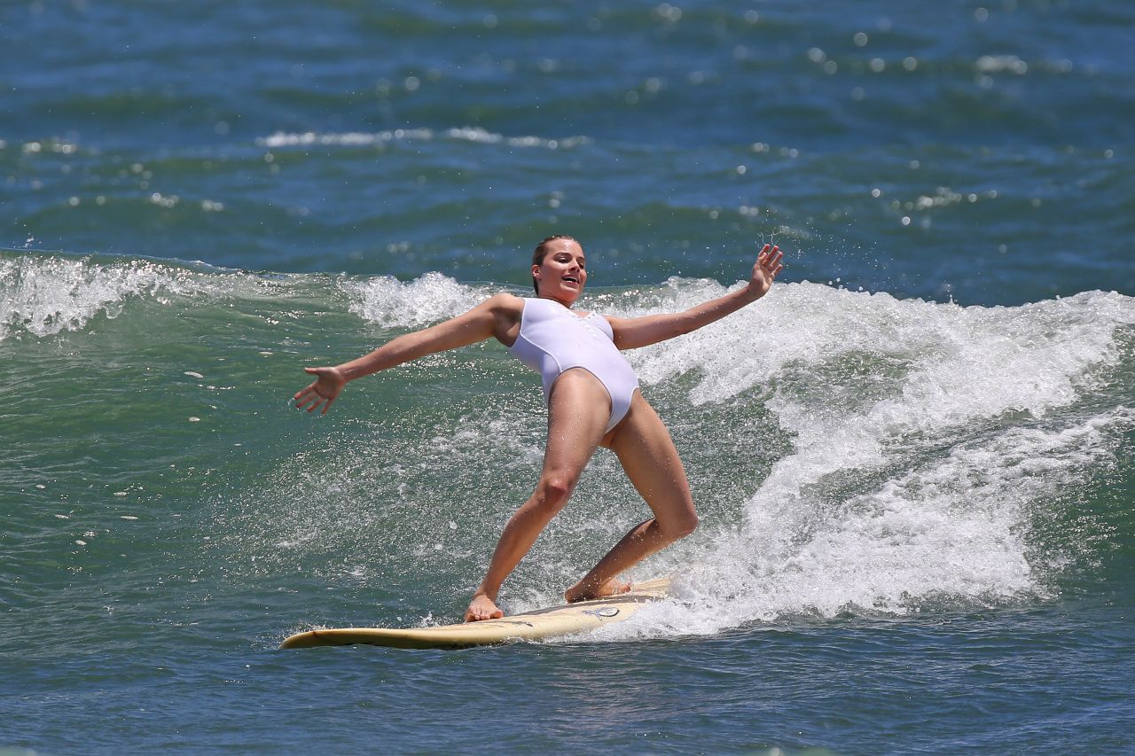 Margot Robbie in Swimsuit - Surfing in Hawaii 7/19/2016.