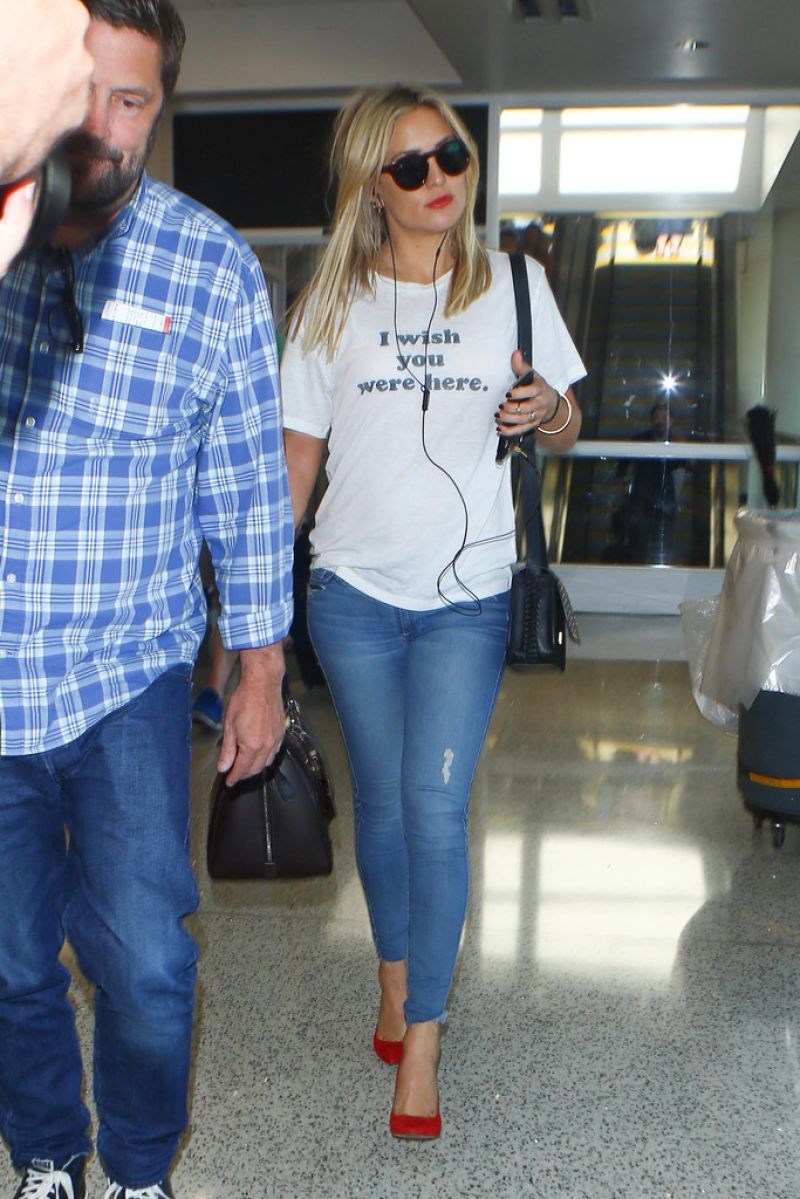 Kate Hudson arriving at LAX airport with personalised Louis