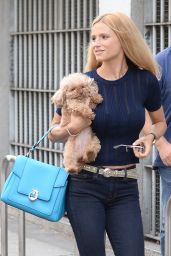 Michelle Hunziker - Carries Her Dog Lilly to a Media Appearance in Milan 9/2/2016