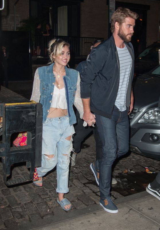 Miley Cyrus Holding Onto Liam Hemsworth