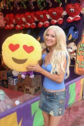 Sara Barrett Wins a Smiley Face Icon Pillow at the Fair in Malibu 9/4/2016