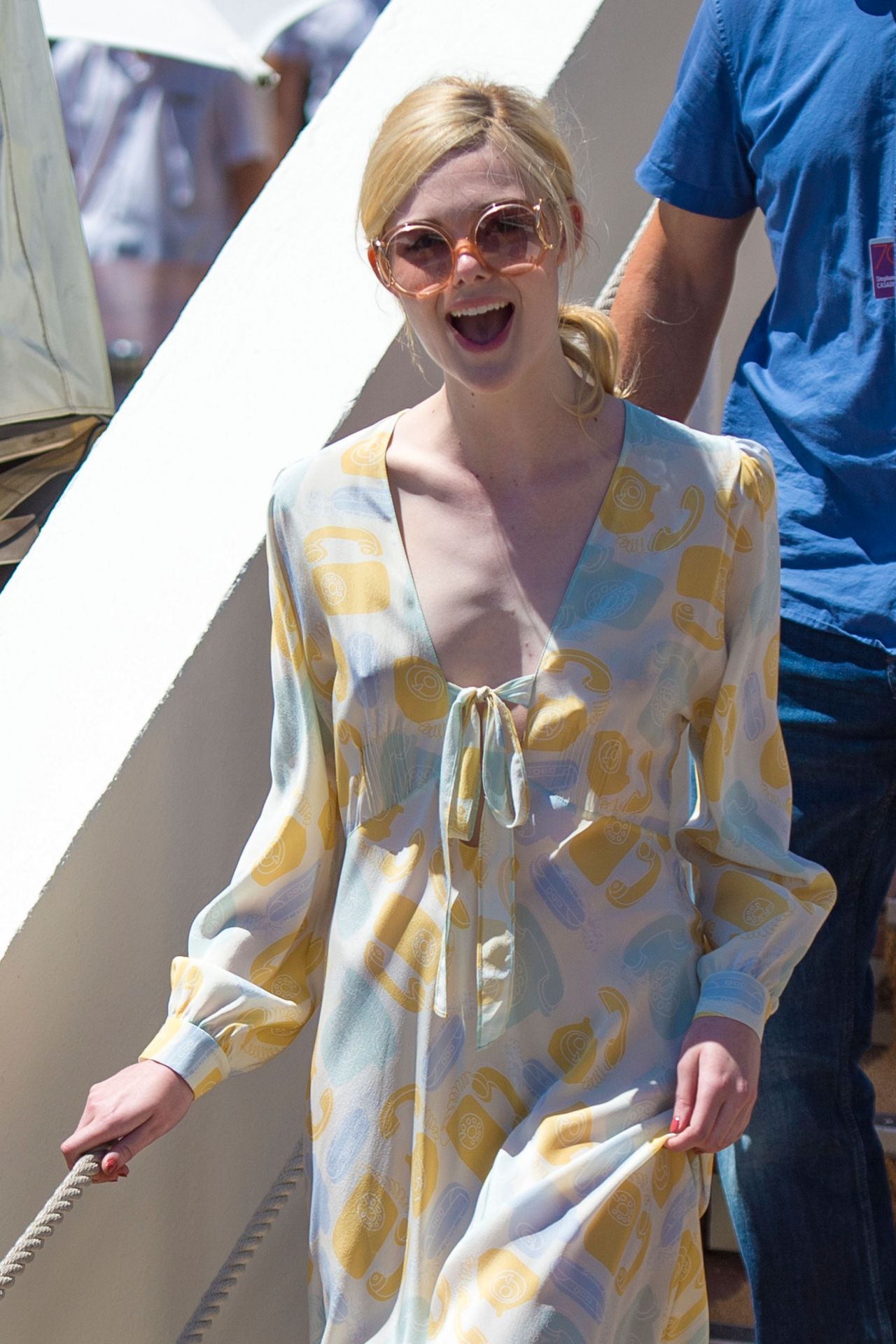 Elle Fanning - Wearing a 'Telephone' Print Dress in Cannes 05/19/2017