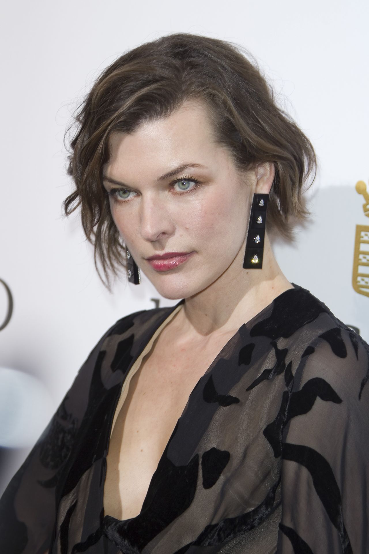 Milla Jovovich - Love On The Rocks Photocall Party at Eden Roc in Cap d