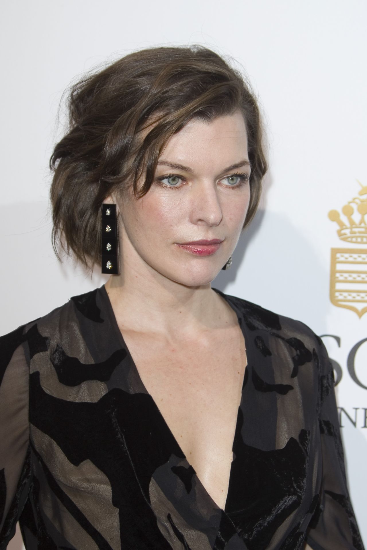 Milla Jovovich - Love On The Rocks Photocall Party at Eden Roc in Cap d ...