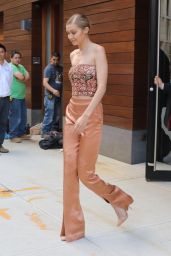 Gigi Hadid in Glitzy Top and a Pair of Shimmery Orange-Gold High-Waist Pants - NYC 06/26/2017
