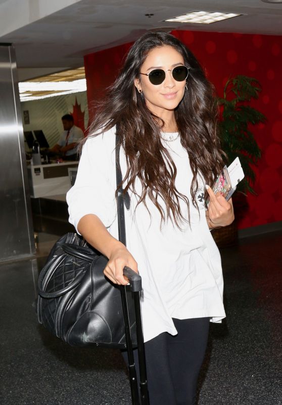 Shay Mitchell - Spotted at LAX Airport dressed in a casual stare long sleeve in LA June 17, 2017