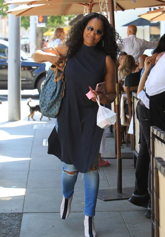 Garcelle Beauvais Looks Stylish in a Long Black Top and Blue Jeans - Beverly Hills 07/25/2017