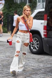 Hailey Baldwin Wearing a Tank Top and a Pair of Distressed White Trousers - NYC 07/28/2017