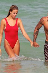 Hailey Clauson in a Baywatch Inspired Red Swimsuit - Beach in Miami 07/23/2017