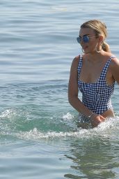 Tallia Storm in Swimsuit - Rides a Paddle Board in Marbella 08/18/2017